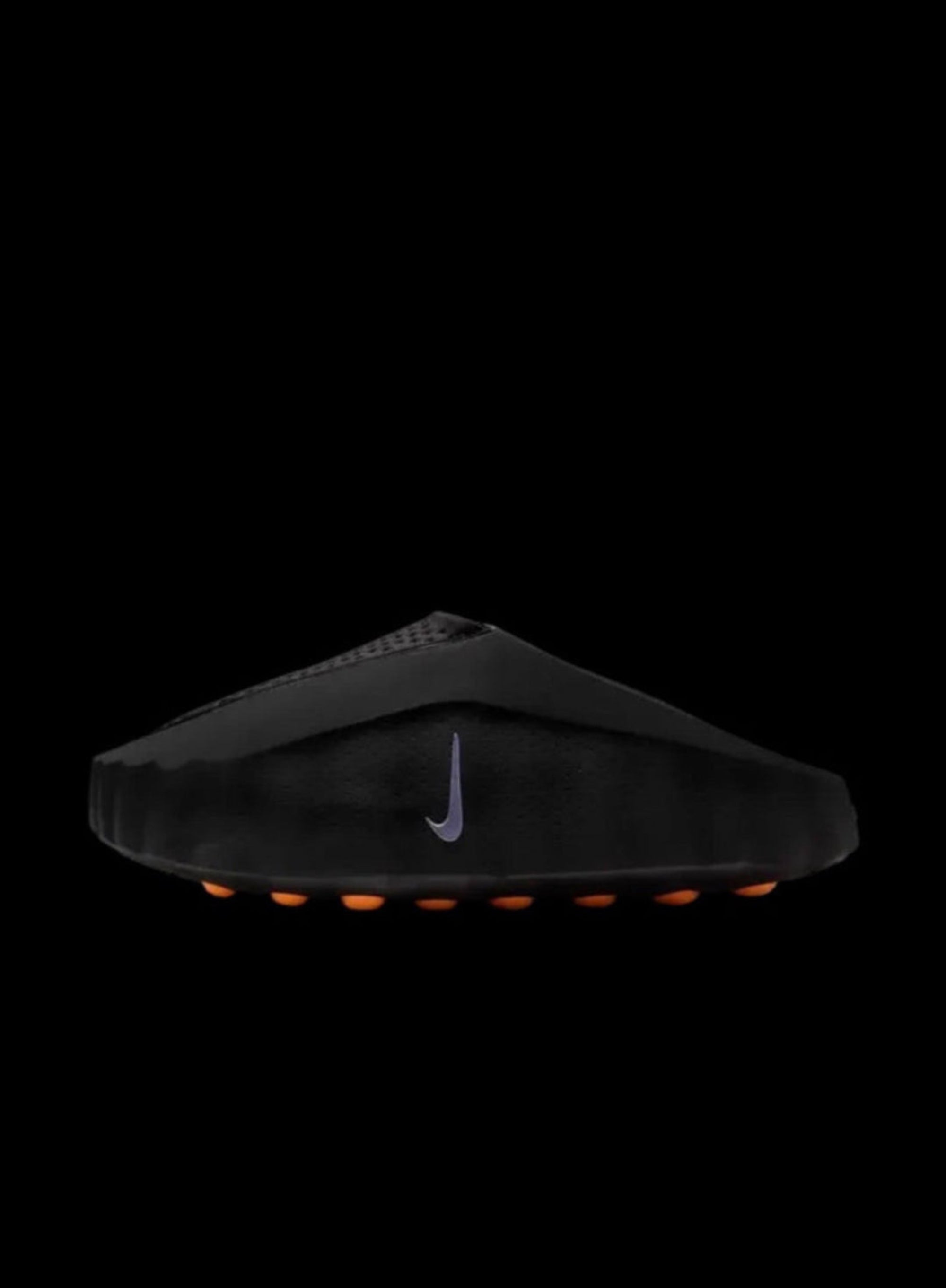 Black sandal with a Nike logo on a white background